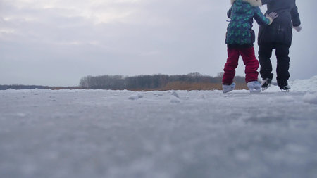 People skate on skating rink in the winter on ice, active winter a holiday family sports