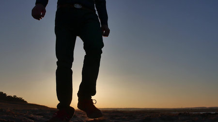 travel. Man is walking at sunset silhouette journey travel lifestyle