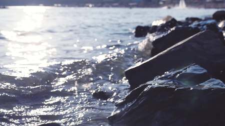 Sea stones water background in a morning sunlight. Sea stones background in a morning sunlightの写真素材