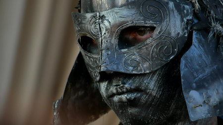 Ancient warrior or Gladiator posing over a dark background