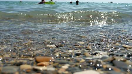 Sea beach pebbles wave. Ocean water abstract backgroundの写真素材