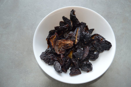 Dry plums for a lunch or breakfastの写真素材