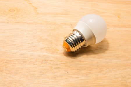 Led bulb on wooden table