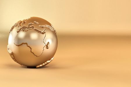 Gold three-dimensional earth on yellow background. 3dの写真素材