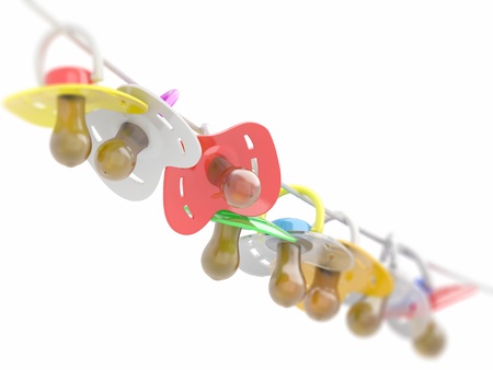 Row of babies dummies on rope. 3dの写真素材