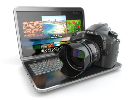 Digital photo camera and laptop. Journalist  or  traveler equipment. 3d