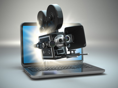 Video concept. Retro camera and  laptop. 3dの写真素材
