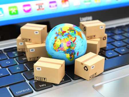 Shipping, delivery and logistic concept. Earth and cardboard boxes on laptop keyboard. Online...