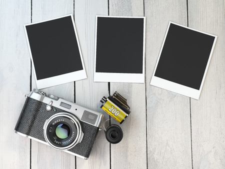 Retro camera, empty photo frames pictures and film canisterrs  on wood table. 3d illustrationの写真素材