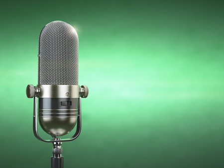 Retro old microphone. Radio show or audio podcast concept. Vintage microphone on green background. 3d illustrationの写真素材