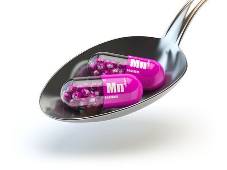 Pills with manganese MN element in the spoon. Dietary supplements. Vitamin capsules. 3d illustrationの写真素材