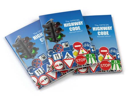 Highway code book.  Book of traffic rules and law with traffic road sign and traffic light....