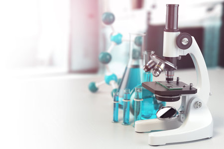 Microscope with lab glassware, flasks and colbas.Science laboratory research and chemistry white...