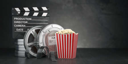Cinema movie concept  background. Film reel and tape, popcorn and clapperboard on black grunge background. 3d illustratioonの写真素材