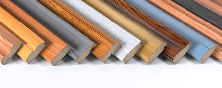 Set of wooden furniture CMD or MDF profiles. Samples of baseboards from different types of wood.