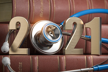 2021 Happy New Year for health care medicine and pharmacy industry. Number 2021 with stethoscope on...