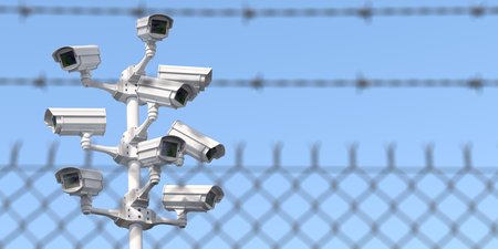 CCTV secutity cameras system and barbed wire fence. Privacy, security and protection concept. 3d illustrationの写真素材