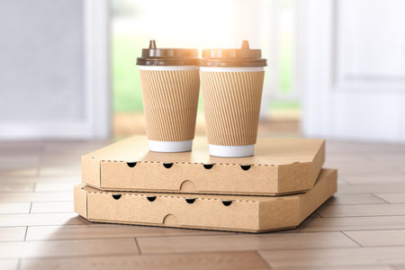 Pizza and coffee buying online and devilry. Pizza cardboard boxes and coffee plastic cup in front of...