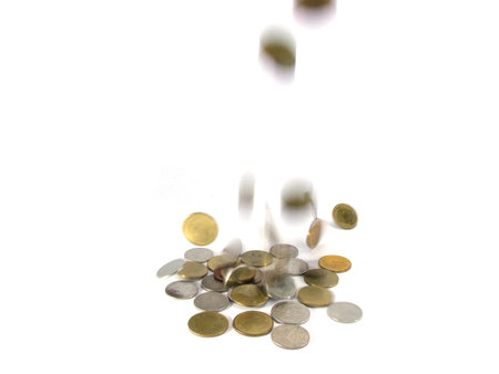 falling coins on white backgroundの写真素材