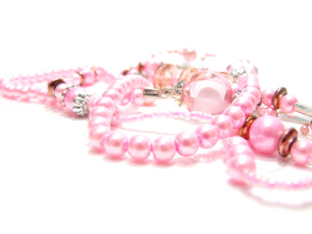 pastel colored bead and pearls on a white backgroundの写真素材