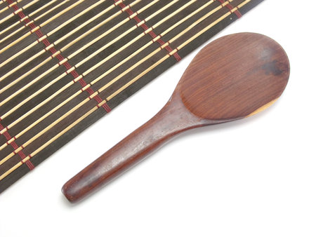 wood ladle on wood matの写真素材