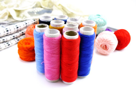 set of color threads on a white background