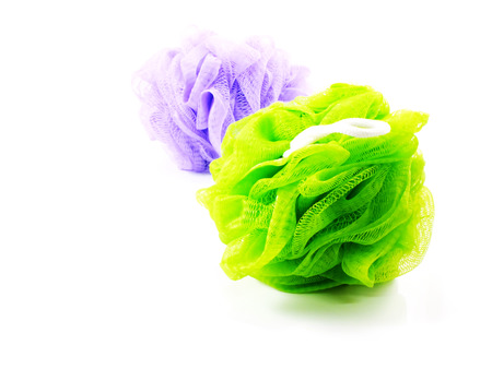 plastic bath puff isolated on white backgroundの写真素材