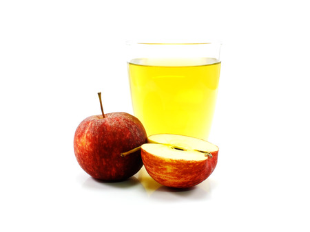 apple juice in glass isolated on white backgroundの写真素材