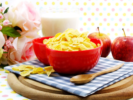 morning breakfast with fresh apple cornflake and milk selective focus