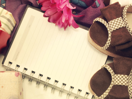 blank notebook and flowers still life retro filter backgroundの写真素材