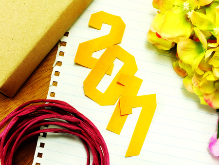 vintage happy new year background happy new year lettering with the gift on wooden backgroundの写真素材