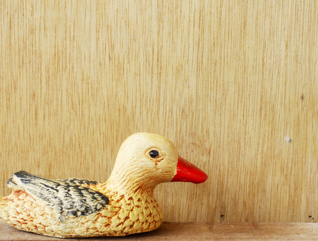 cute baked clay dolls for decorate garden and house still life on wooden backgroundの写真素材