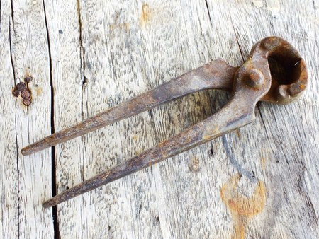 old rusted tools on wooden tableの写真素材