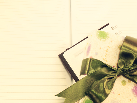 note book diary and beautiful flower bouqet with vintage filter instragram effect;の写真素材