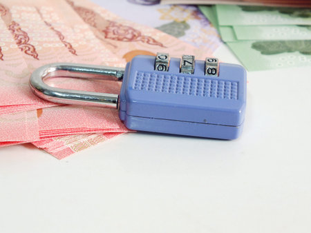 concept of saving money lock on background close up