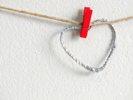 heart symbol hanging wit ropeの写真素材