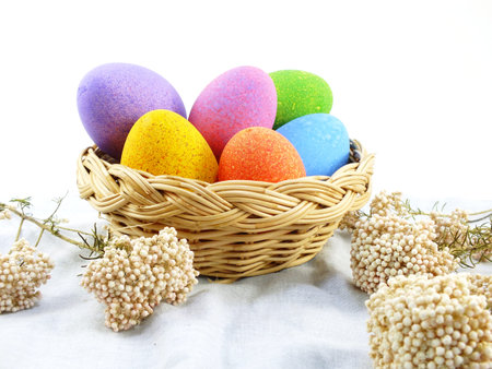 colorful easter eggs with spring flowers background