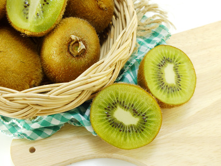 delicious fresh kiwi fruit on a chopping boardの写真素材