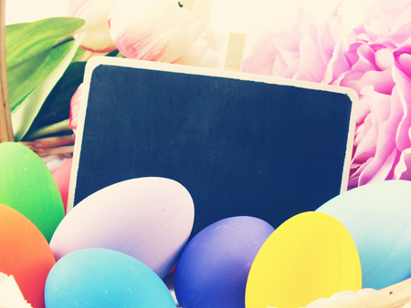 colorful easter eggs with spring flowers background vintage filter colorの写真素材