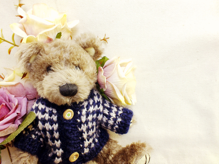 teddy bear with bunch of flowers copy space backgroundの写真素材