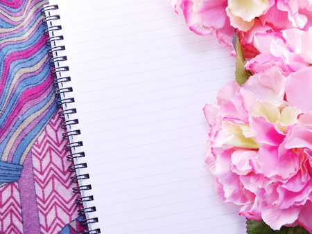 blank notebook with bouquet of flower vintage filters backgroundの写真素材