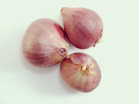 red onion bulb on white backgroundの写真素材