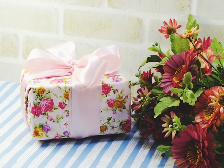 beautiful romantic gift box and flower on blue backgroundの写真素材