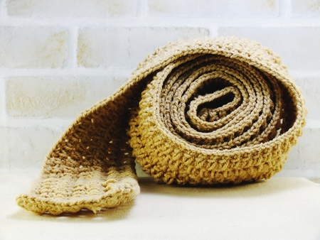 warm knitted scarf female accessory with copy space backgroundの写真素材
