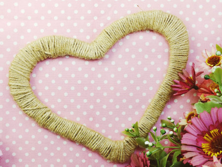 heart symbol decoration with artificial rosesの写真素材