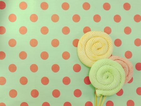 marshmallow lollipop on polka dot backgroundの写真素材
