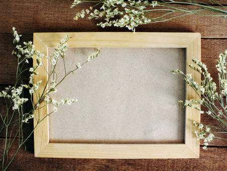 wooden photo frames space background decorate with dried flowers