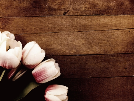 wood background with flowers bouquet vintage filter colorの写真素材
