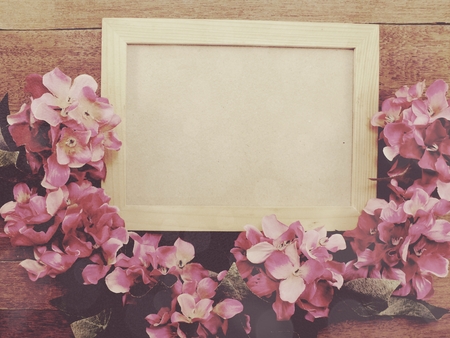 frame of bouquet flowers background wooden boards copy space;の写真素材