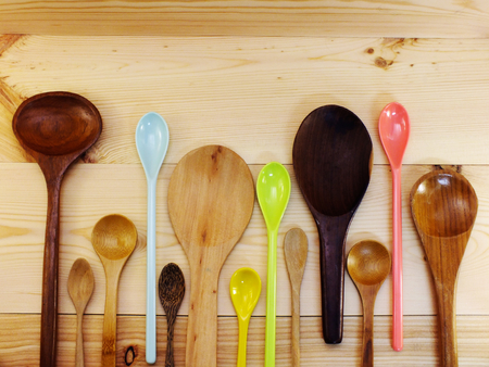 collection of wooden spoon and ladles on wooden tableの写真素材